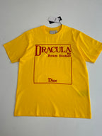 Yellow short-sleeve T-shirt with “DRACULA” front graphic and logo box.