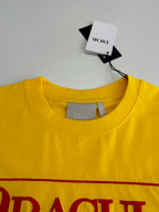 Yellow crew-neck T-shirt with interior neck label and size tag.