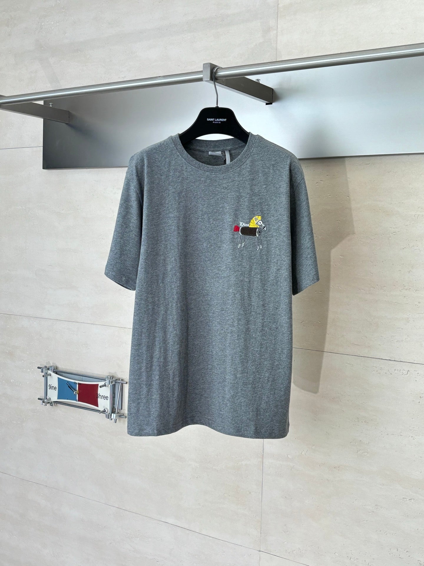Gray short-sleeve T-shirt with small multicolor embroidered cartoon logo on chest