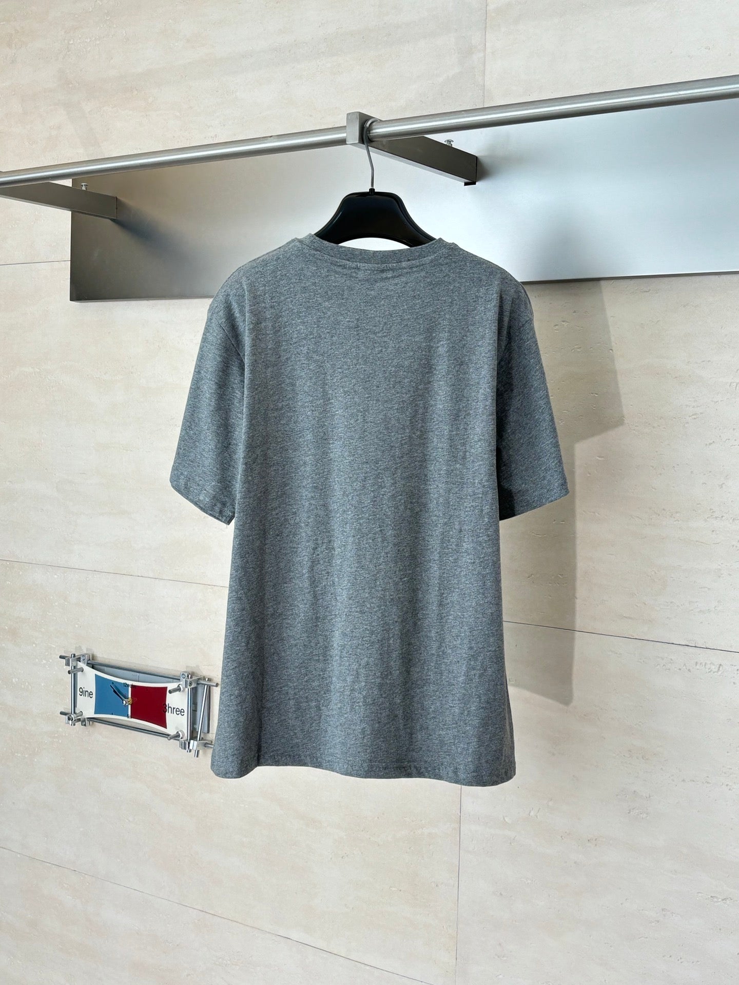 Gray short-sleeve T-shirt back view, crew neck, plain design