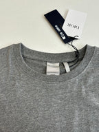 Gray crew-neck T-shirt with neck label and inside seam detail