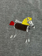 Gray T-shirt with large embroidered cartoon patch logo on chest