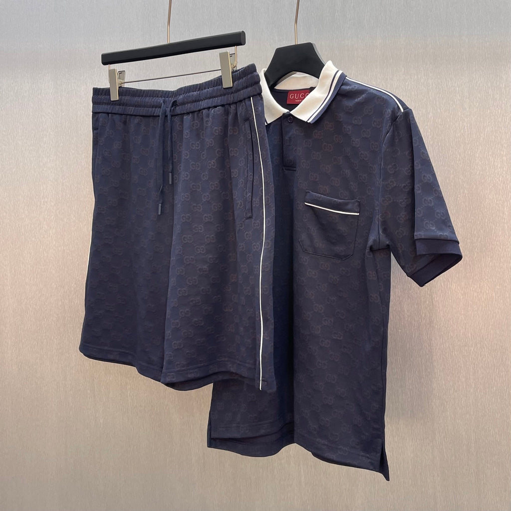 Gucci shorts and matching navy polo shirt set, GG logo pattern and pocket on shirt