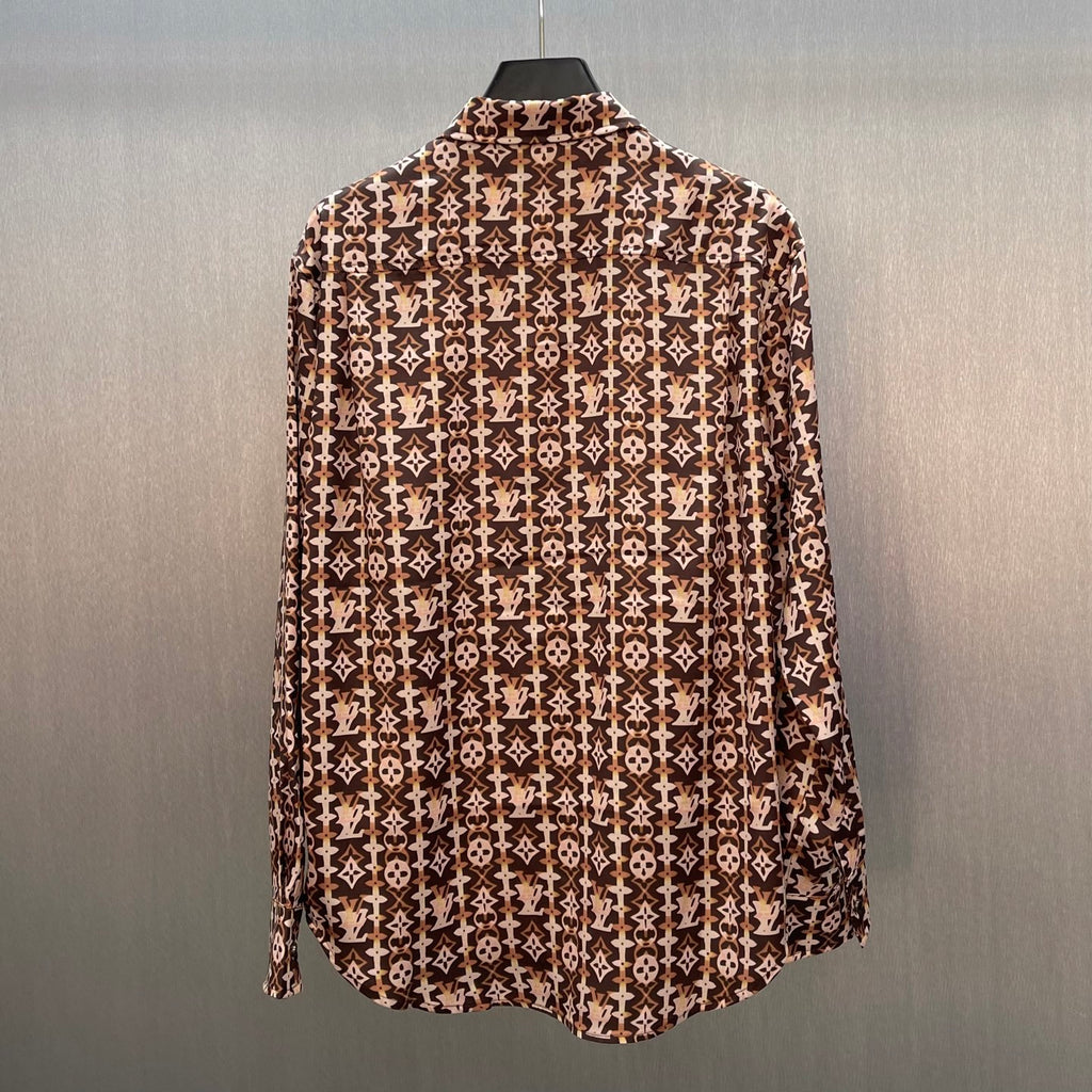 Long-sleeve button-up shirt with brown-and-cream monogram pattern, curved hem