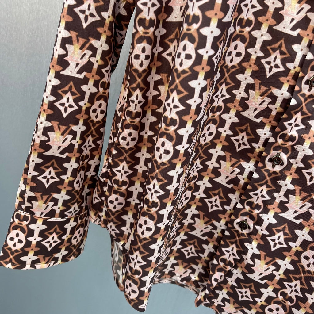 Long-sleeve button-up shirt with brown-and-cream geometric monogram pattern