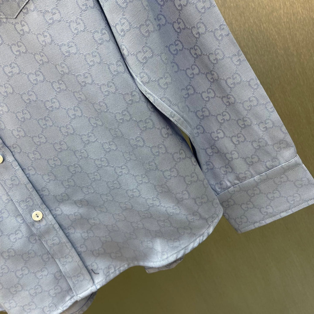 Light blue Gucci shirt with GG pattern, side seam and buttoned placket