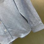 Light blue Gucci shirt with GG pattern, side seam and buttoned placket