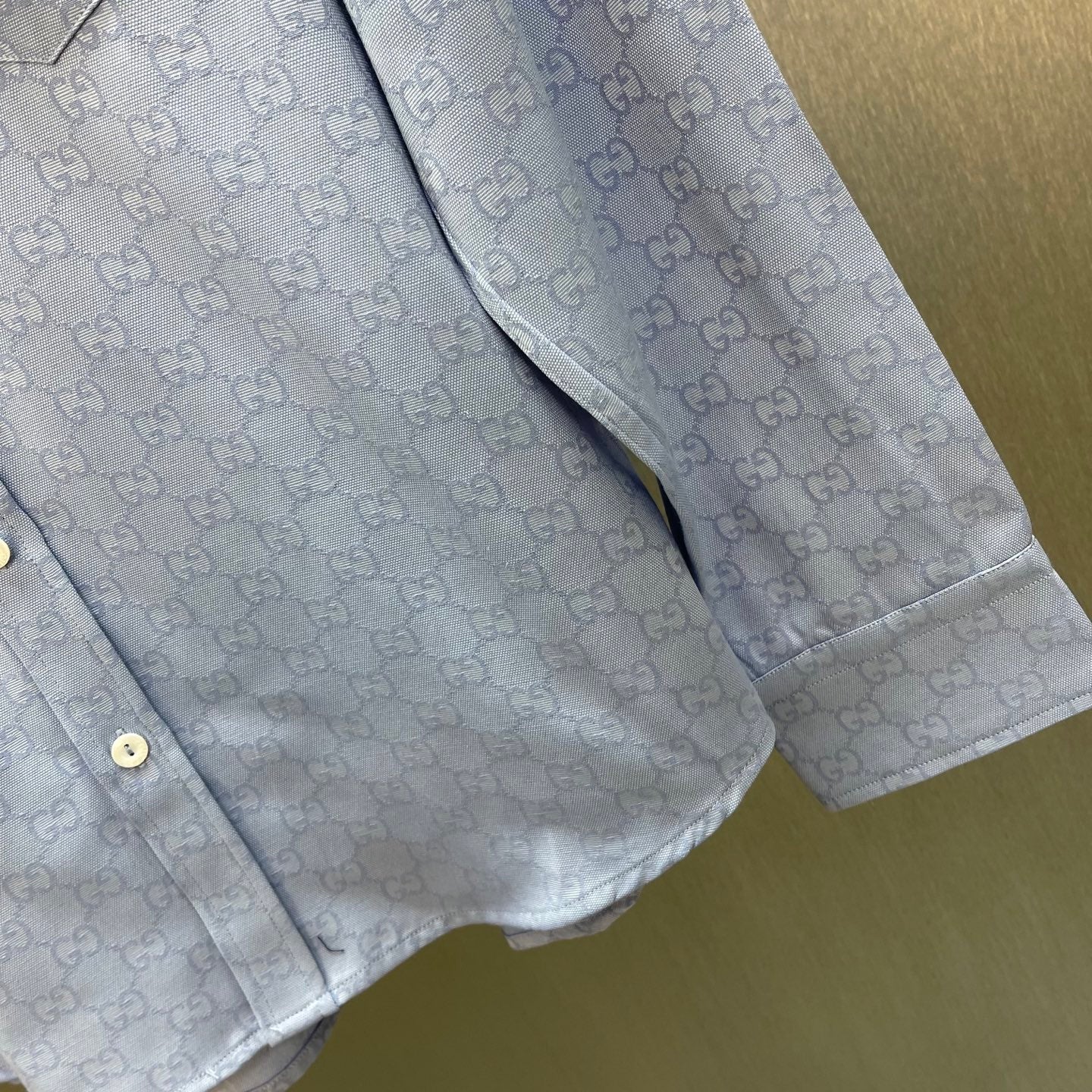 Light blue Gucci shirt with GG pattern, side seam and buttoned placket