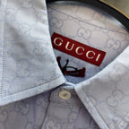 Light blue Gucci shirt inside collar with label, button fastening and GG pattern