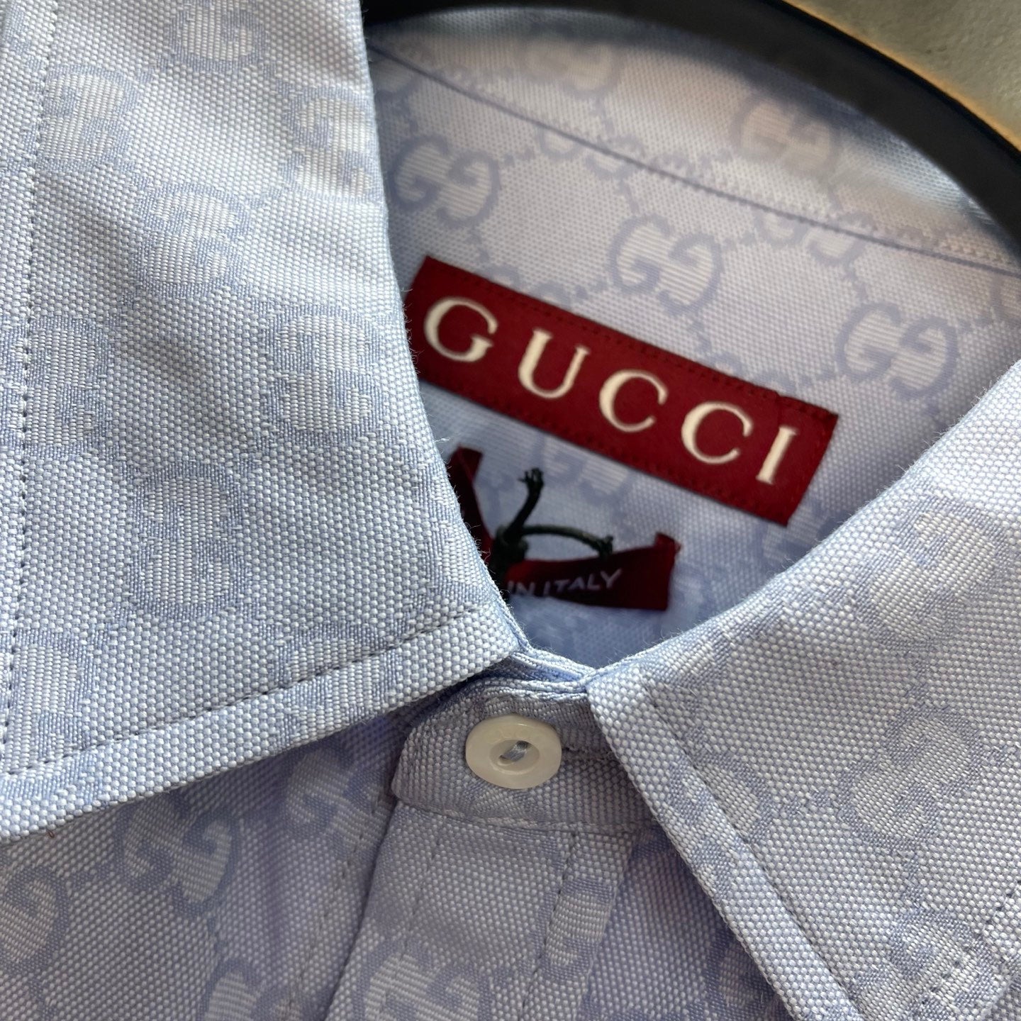 Light blue Gucci shirt inside collar with label, button fastening and GG pattern