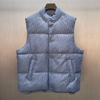 Quilted puffer vest with button front, stand collar, and monogram pattern in light blue