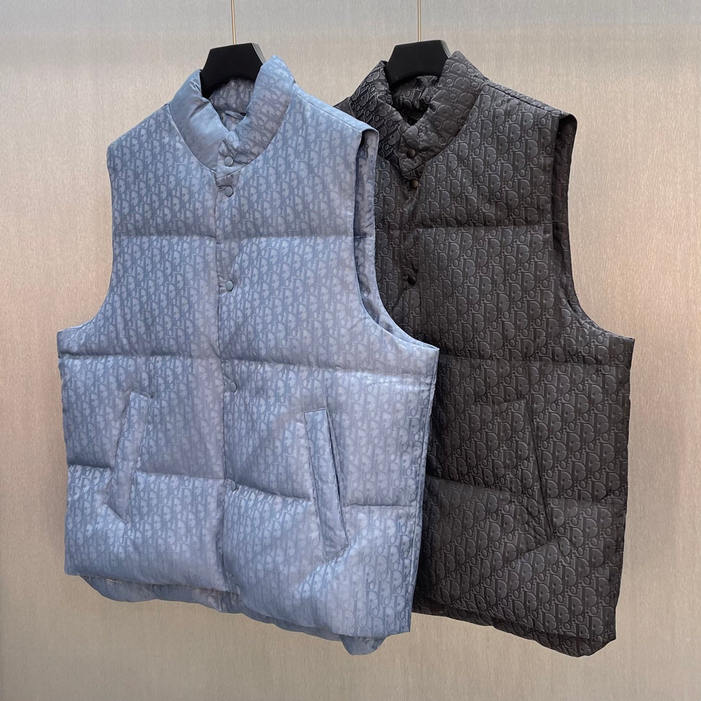 Quilted monogram puffer vests in light blue and dark colors, both with button fronts