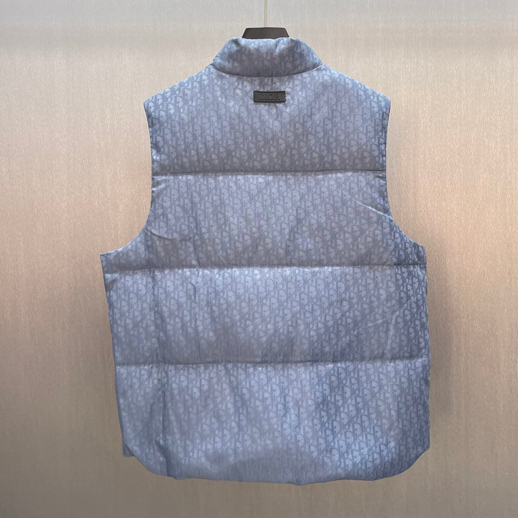 Light blue monogram quilted puffer vest front view with stand collar