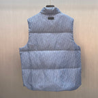 Light blue monogram quilted puffer vest front view with stand collar