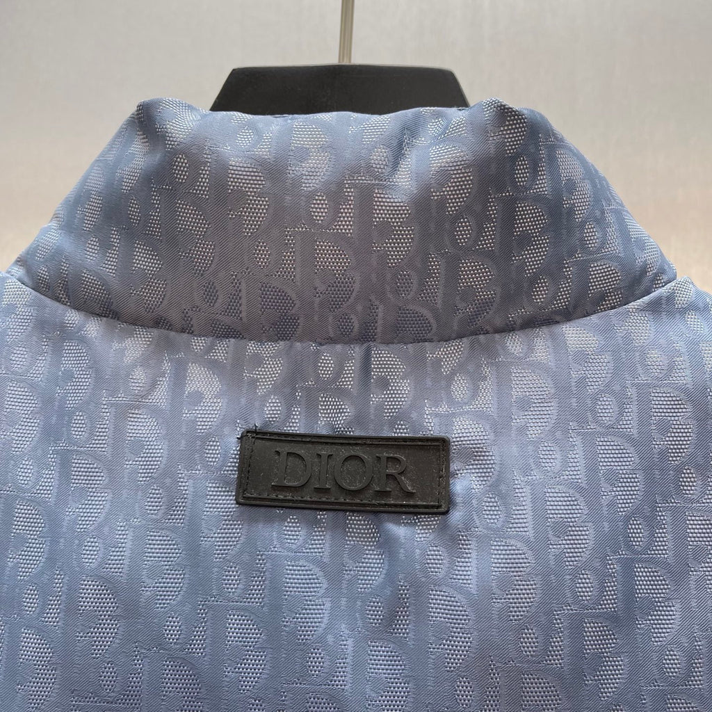 Light blue monogram puffer vest back view with Dior label