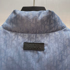 Light blue monogram puffer vest back view with Dior label