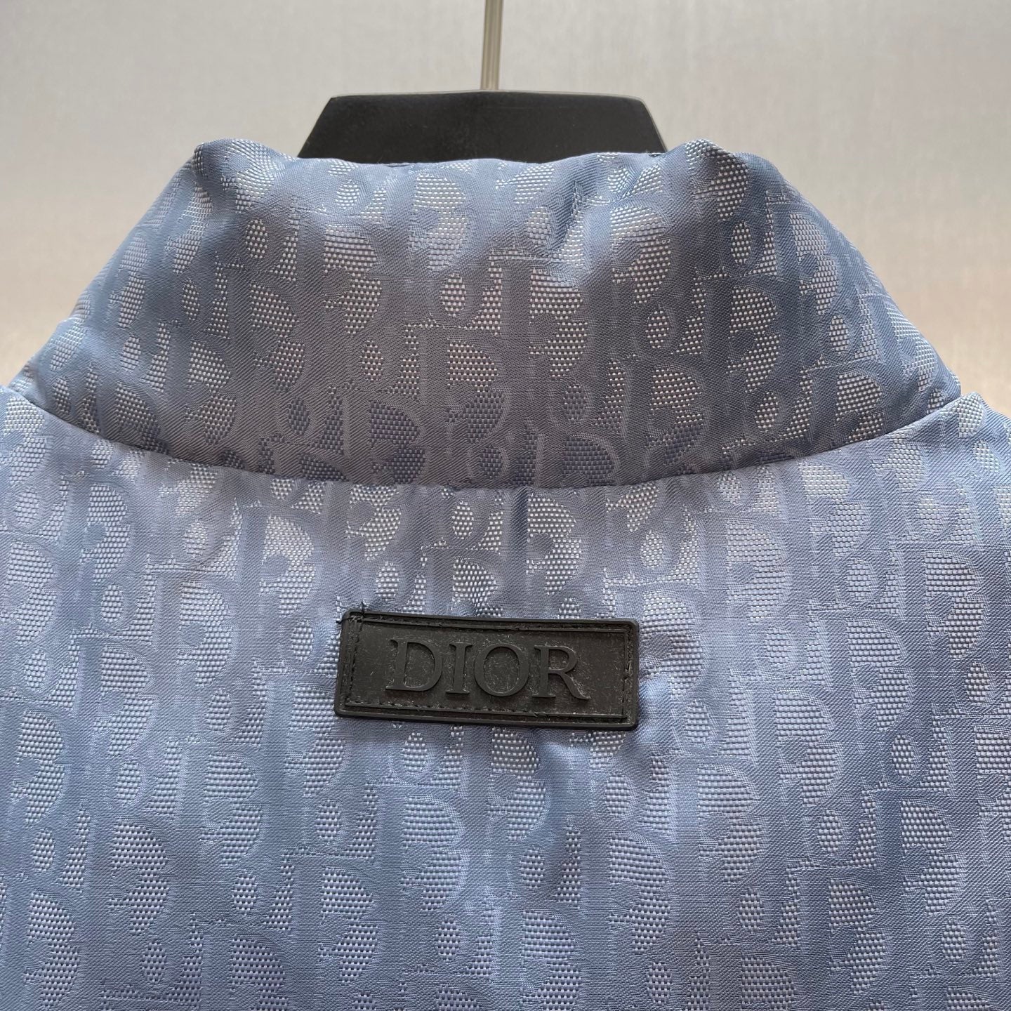 Light blue monogram puffer vest back view with Dior label