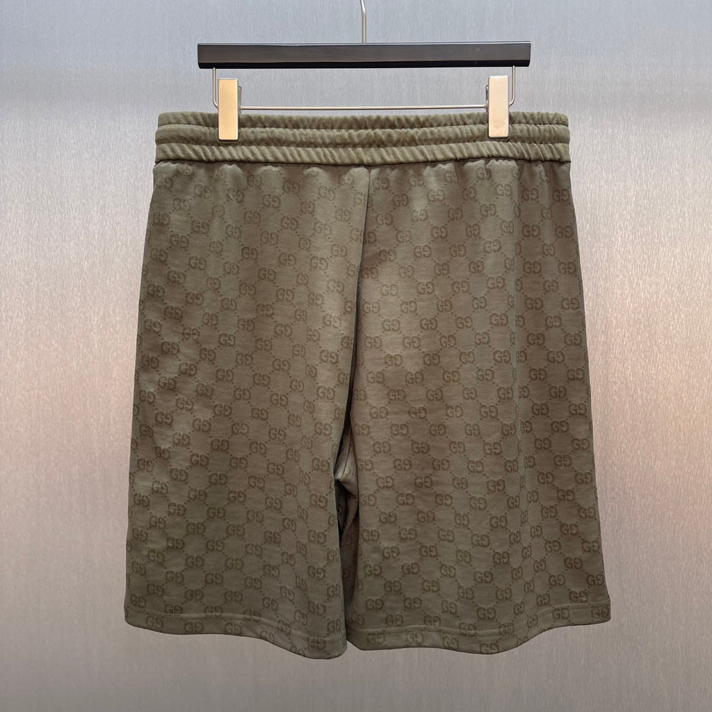 Men's GG monogram shorts with elastic waistband and straight hem, olive-brown.