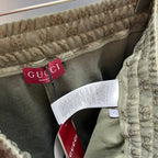 GG monogram shorts showing Gucci tag and interior label at waistband.