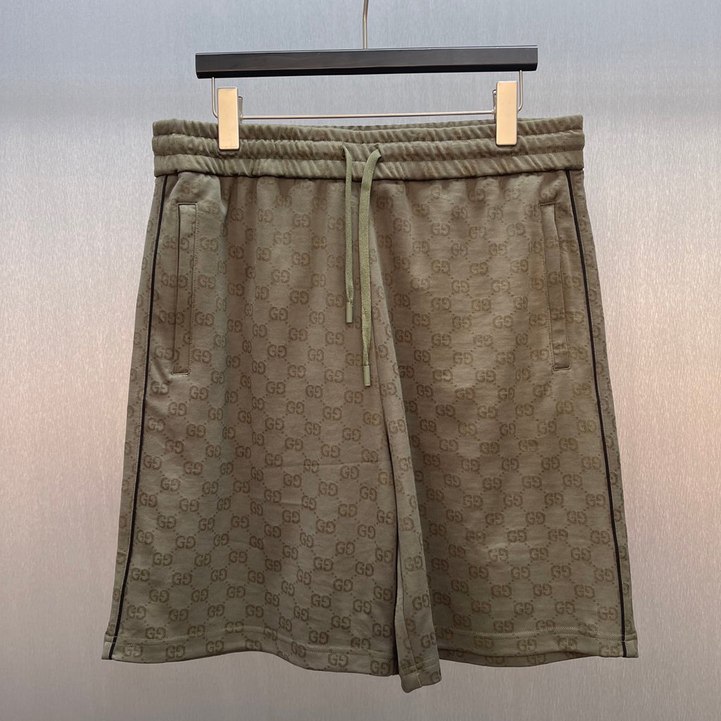 Men's drawstring shorts with GG monogram pattern and elastic waistband, olive-brown.