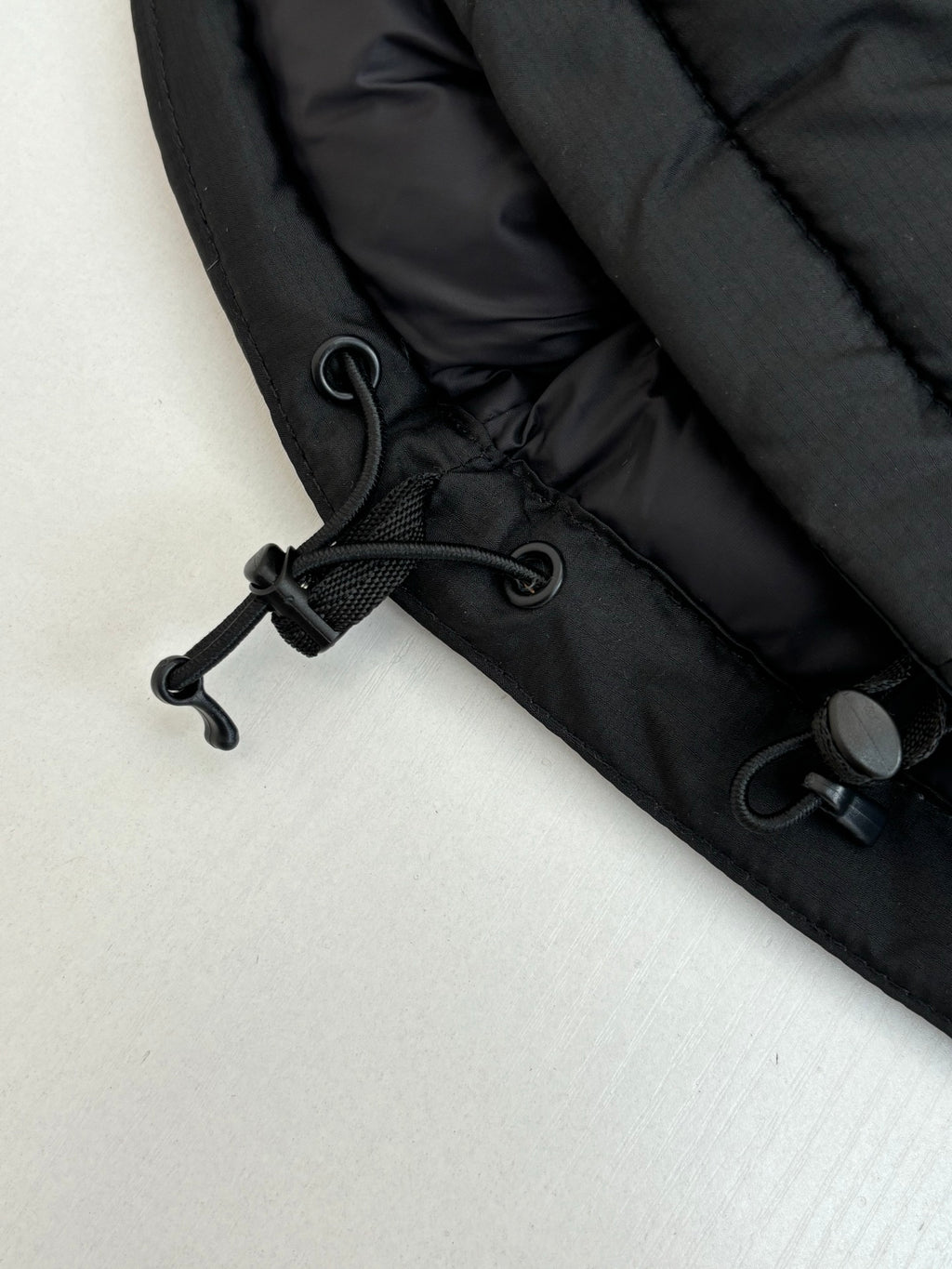 Ralph Lauren black puffer jacket hem with drawstring cord and toggle