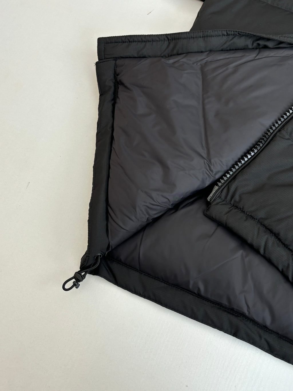 Ralph Lauren black puffer jacket interior lining with diagonal zip pocket