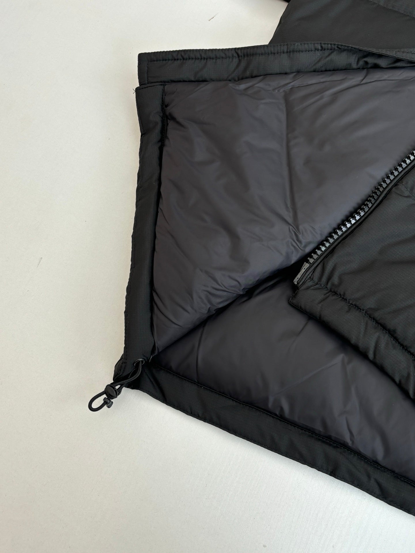 Ralph Lauren black puffer jacket interior lining with diagonal zip pocket