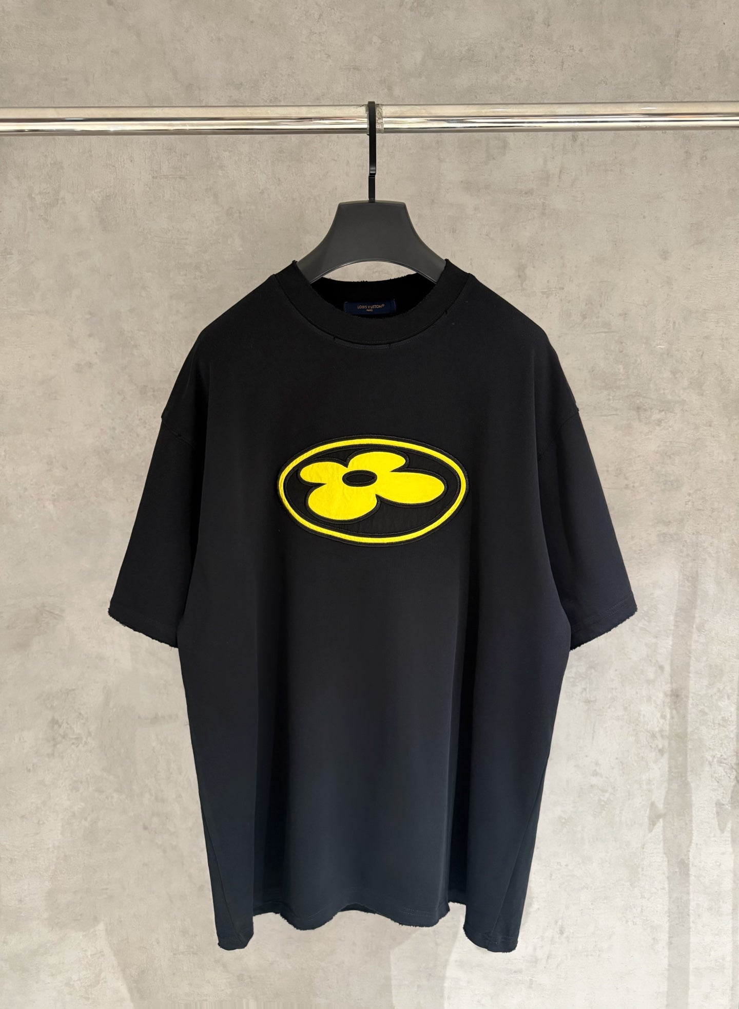 Black Louis Vuitton T-shirt with yellow logo on chest