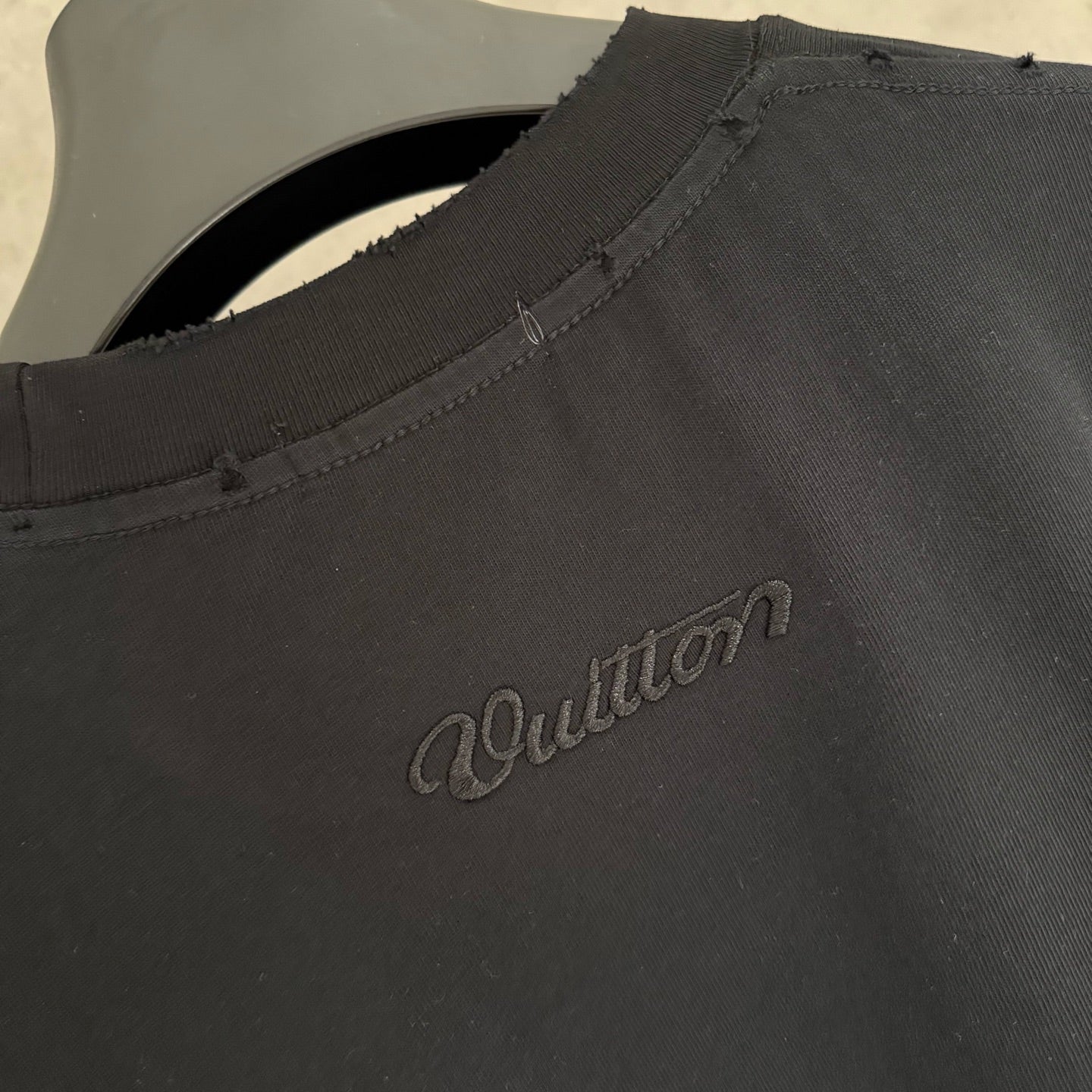 Black Louis Vuitton T-shirt with small back script logo and seam detail