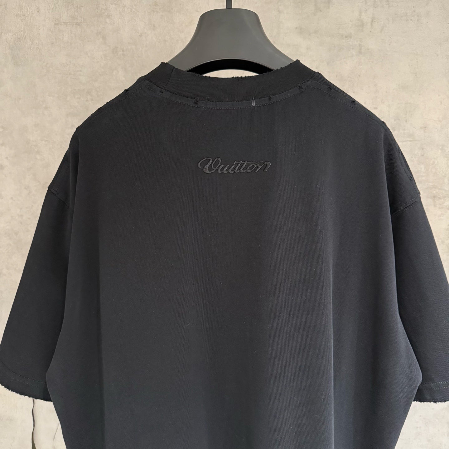 Black Louis Vuitton T-shirt back script logo near center
