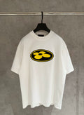 White short-sleeve T-shirt with yellow flower logo on the front