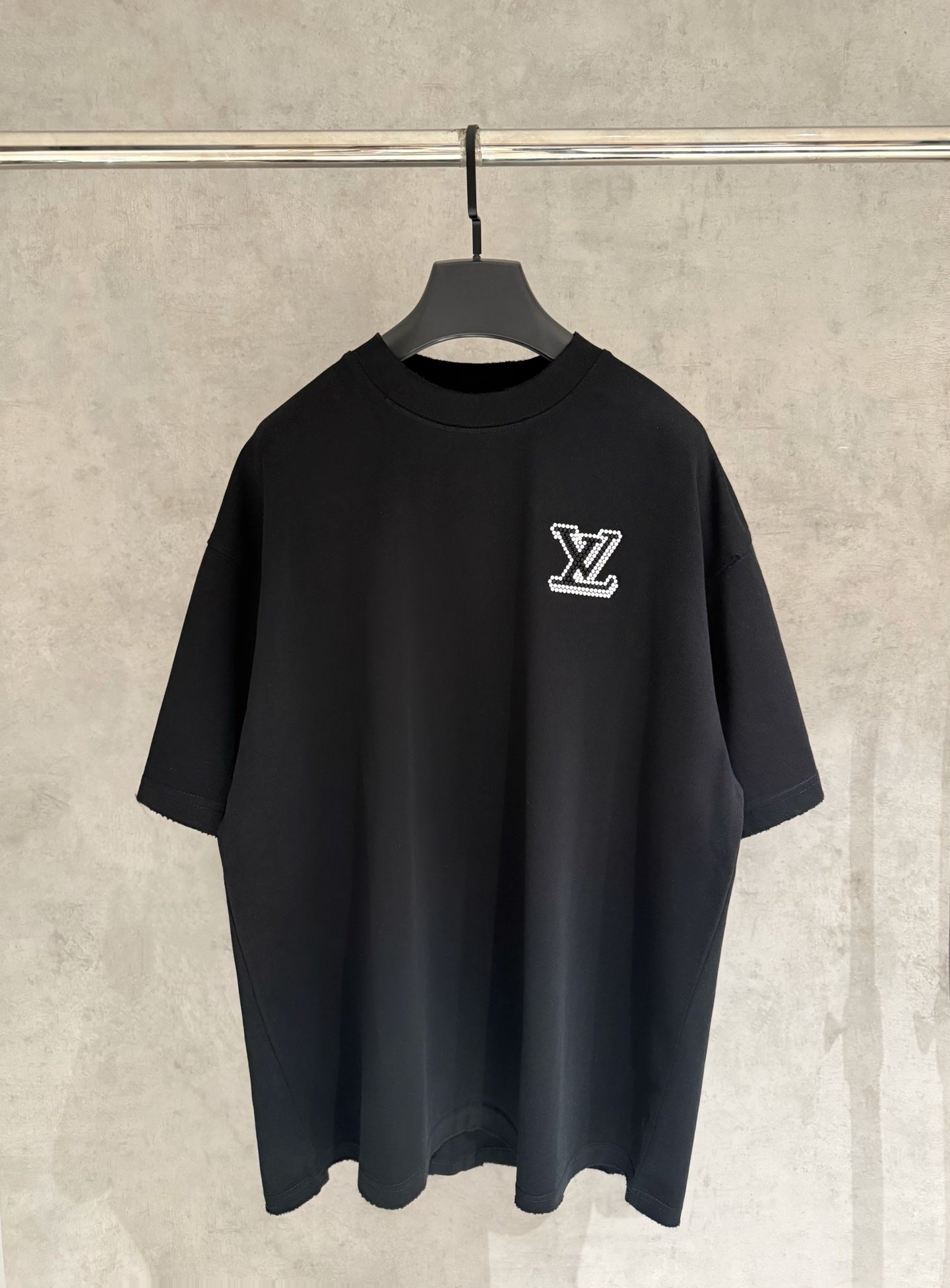 Louis Vuitton black T-shirt with rhinestone LV logo on left chest and short sleeves