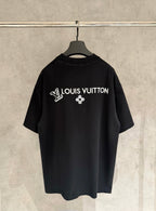 Black T-shirt with rhinestone Louis Vuitton text and clover emblem on back