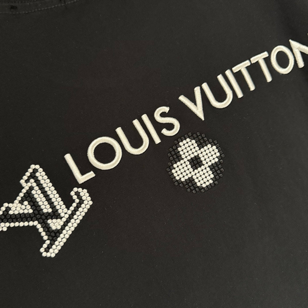 Louis Vuitton black T-shirt back close-up with rhinestone “LOUIS VUITTON” text