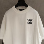 White short-sleeve T-shirt with LV monogram patch on left chest