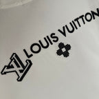 White T-shirt with black Louis Vuitton wordmark and clover emblem detail