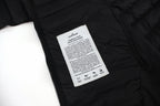 Stone Island puffer jacket care label on inner lining near zipper tape