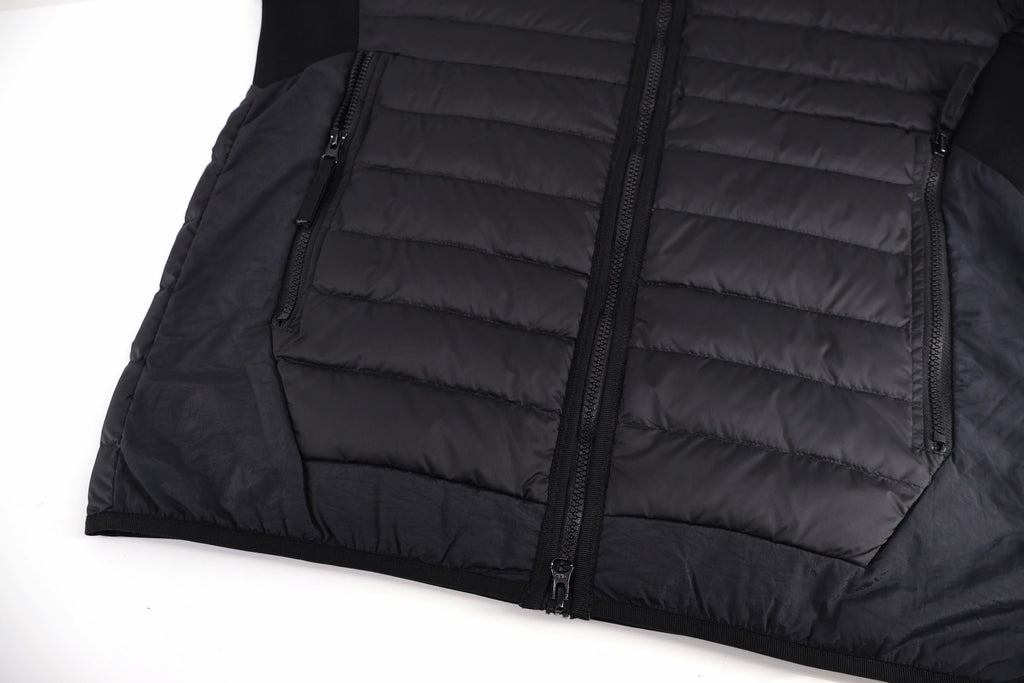 Stone Island black puffer jacket with front zipper and horizontal quilted panels