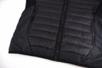 Stone Island black puffer jacket with front zipper and horizontal quilted panels