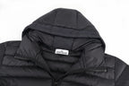 Stone Island puffer jacket hood close-up with chest logo label on black