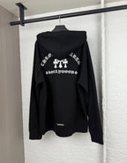 Black hoodie back view with large white graphic and attached hood