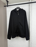 Black zip-up hoodie with attached hood and front kangaroo pocket