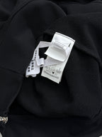 Black hoodie with interior hood label at neckline