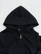 Black zip-up hoodie with drawstring hood and silver zipper detail