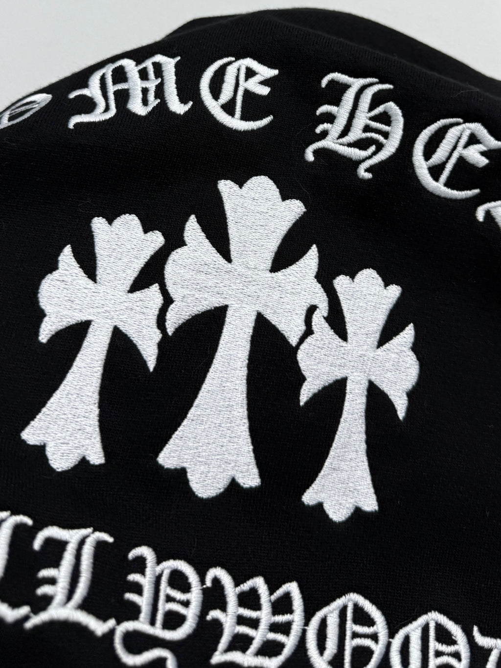Black hoodie back graphic with large white maple leaf motifs