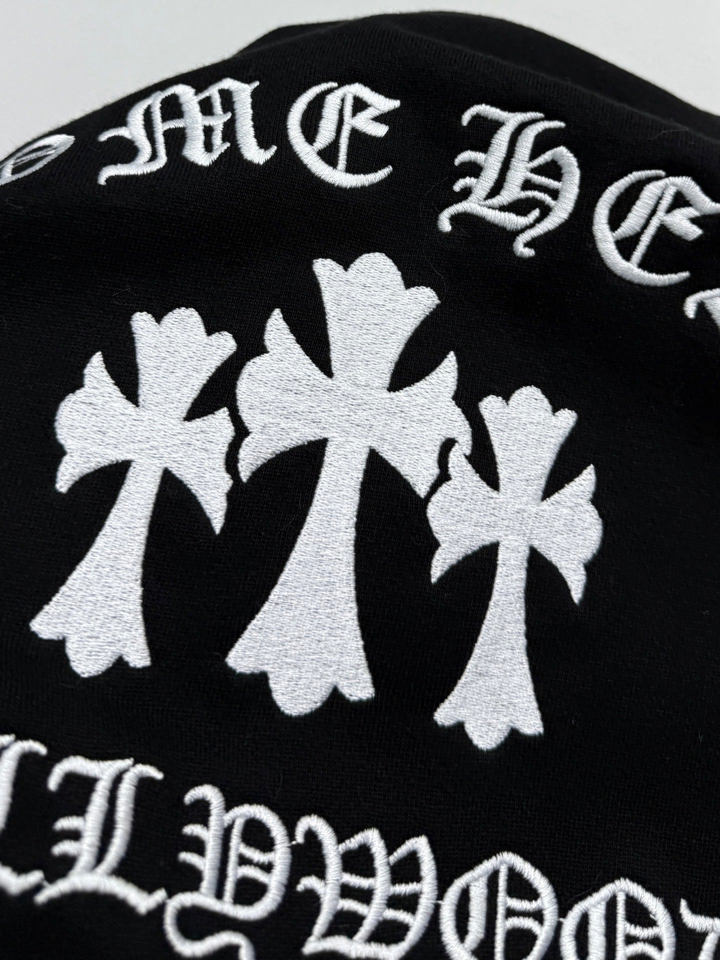 Black hoodie back graphic with large white maple leaf motifs