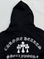 Black hoodie back with white cross-and-leaf style graphic