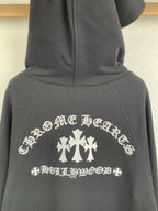 Black long-sleeve zip hoodie with white crest and cross-flower graphic on front