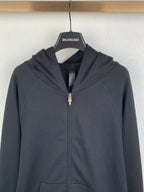 Black zip-up hoodie hood with front zipper and BALENCIAGA neck label