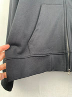 Black zip-up hoodie with kangaroo pocket and stitched hem